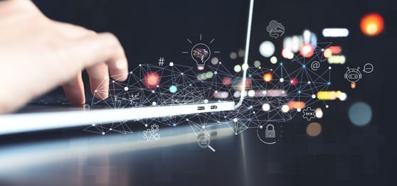 Hands on a laptop, overlaid by tech and AI icons